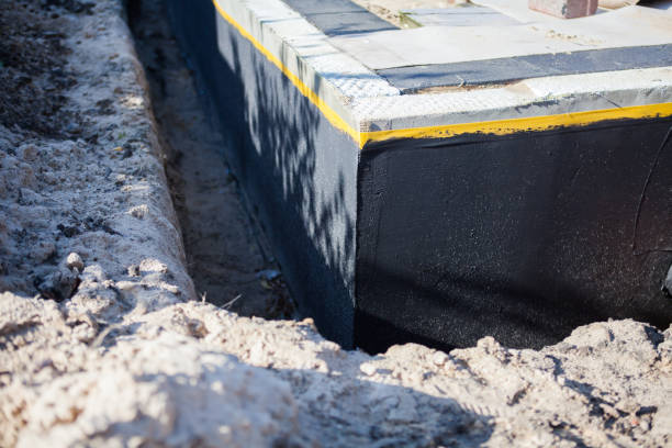 Professional Basement Waterproofing technician working in Tallassee, TN